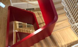 Commercial staircase in Princelet Street, White Chapel, London - natural wood, metal frame and angular in design - by PT Handrails @ Clive Durose