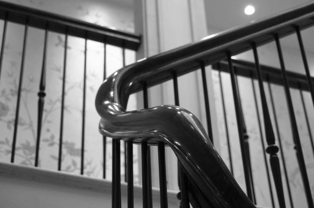 Dark Oak Staircase, tight curves, installed in Harmer Green Lane, Hertfordshire, Designed by Sinead Kelly-Herbert, made and installed by PT Handrails, Clive Durose.