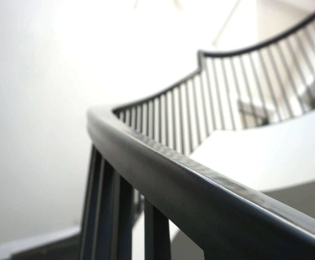 Ebonised Natural Wooden Handrail with sweeping curves, by PT Handrails at Clive Durose Staircase Project @ Bowden in Cheshire