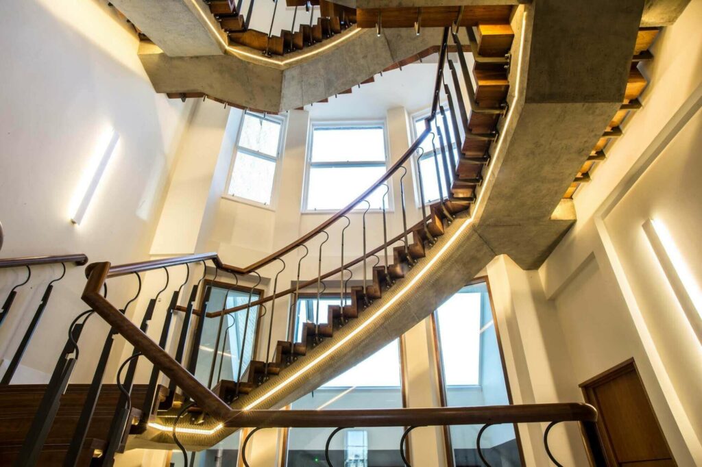 Floating rising staircase with strip lighting in Welbeck Street, Mayfair by PT Handrails at Clive Durose staircase company