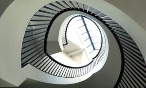 Ikon profile staircase handrail, design by PT Handrails at Clive Durose Staircase Project @ Bowden in Cheshire