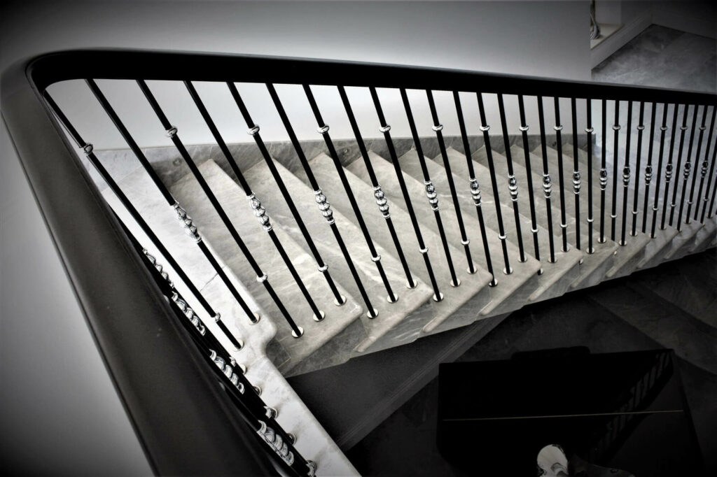 Natural Wood Handrail with sweeping curve, marble staircase, installed at Lower Farm, Gloucestershire, by PT Handrails @ Clive Durose