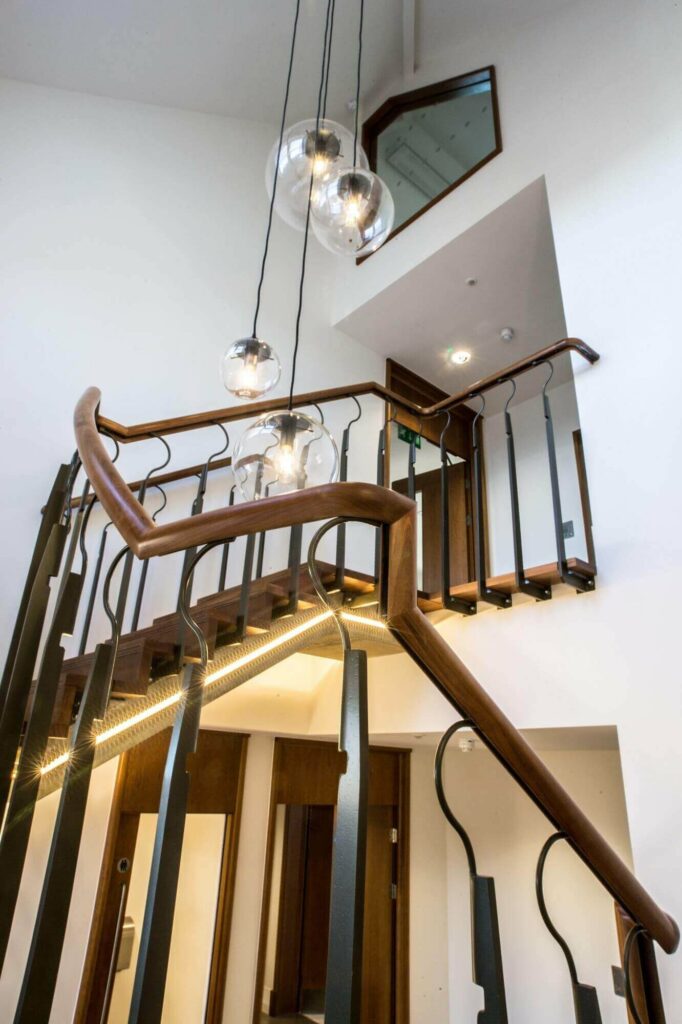 Natural Wood Straights, corners & curves in a handrail, Welbeck Street, Mayfair by PT Handrails at Clive Durose staircase company