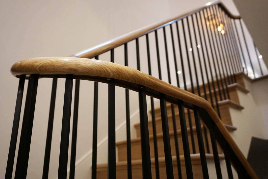 Polished oak finish in this staircase handrail installation in Wilmslow Cheshire by PT Handrails, Clive Durose