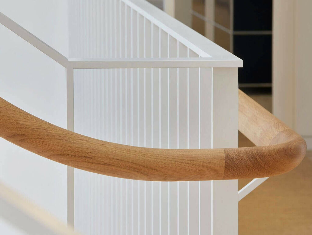 Savile Road commercial staircase handrail system smooth curved rails by PT Handrails, by Clive Durose